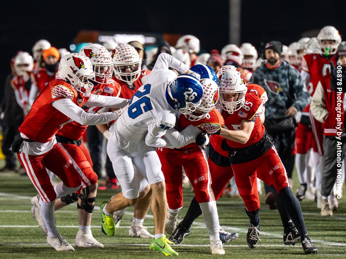 Greenwich High football team captures CIAC Class LL Tournament championship by upending Southington, 45-6; Victory gives Cardinal second straight state title